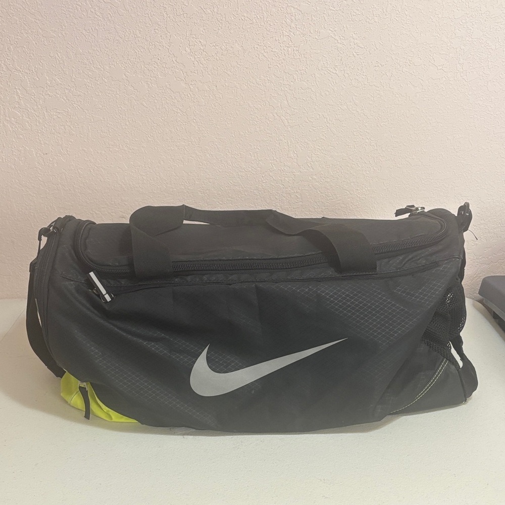 Nike Black and Silver Duffel Bag with Yellow Accents